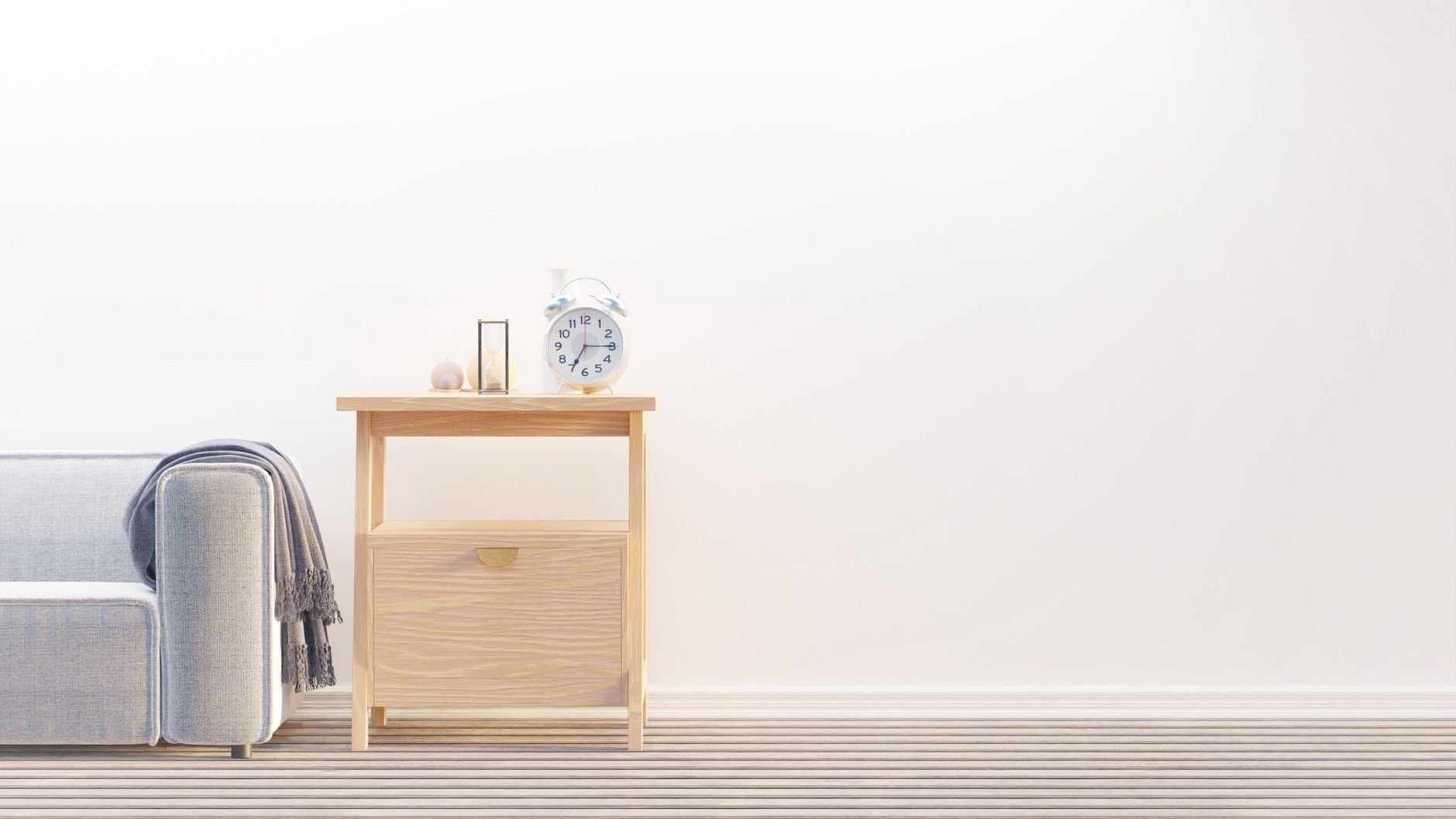 A minimalist living room with wooden table and sofa.
