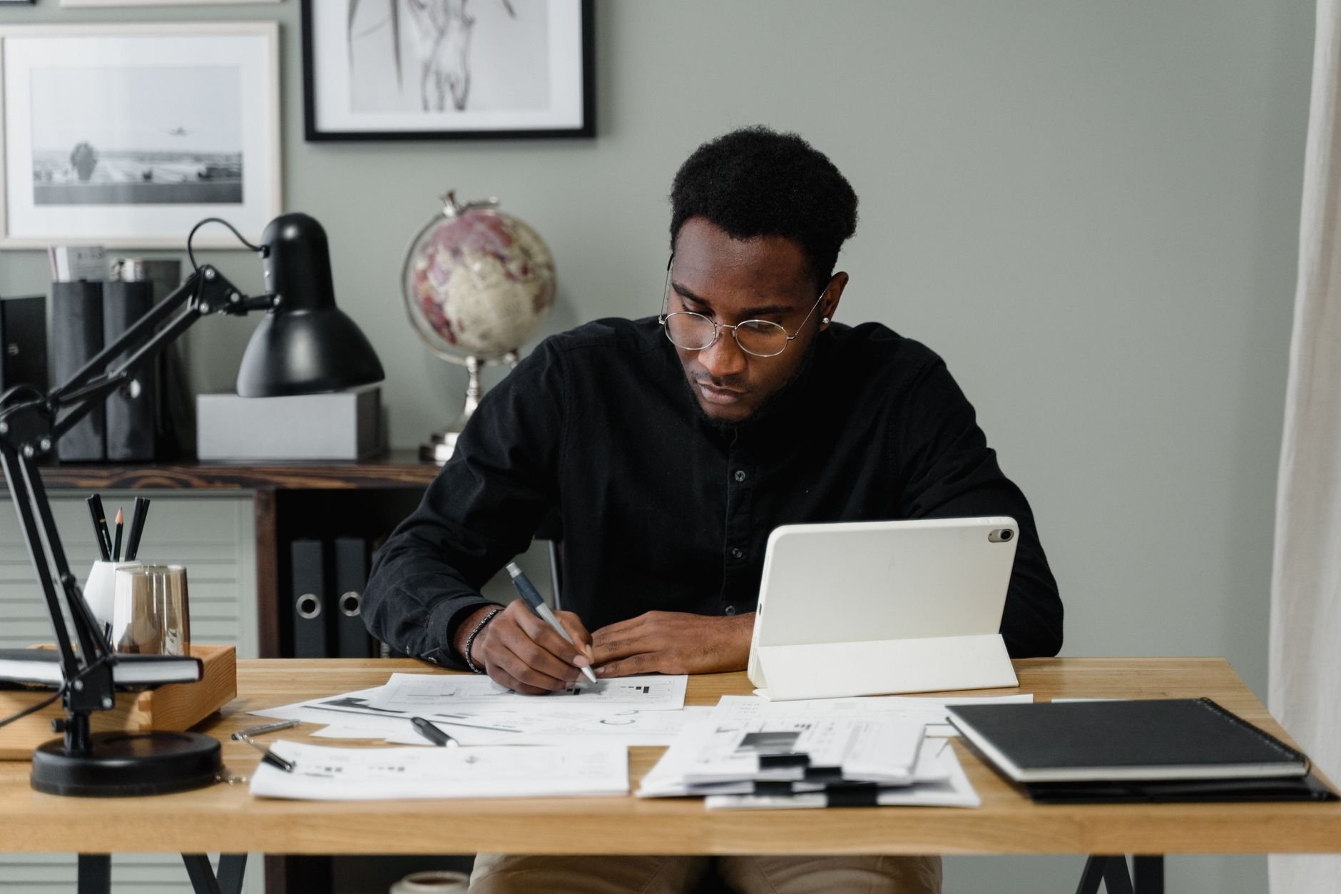 Homeowner reviewing documents on a digital tablet.
